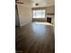 Spacious living room with wood-look floors and large windows at 2072 Mesquite Ln # 104, Laughlin, NV 89029