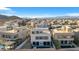 Aerial view of modern homes with a pool, showcasing the community's contemporary architecture and desert landscape at 232 Errogie St, Henderson, NV 89012