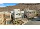 Modern home with a gray stone base and white walls at 232 Errogie St, Henderson, NV 89012