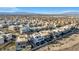 Aerial view of a large community of modern homes, showcasing the expansive landscape and city views in the background at 232 Errogie St, Henderson, NV 89012