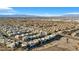 Aerial view showcasing a large community of contemporary homes, offering stunning views of the surrounding landscape and city skyline at 232 Errogie St, Henderson, NV 89012