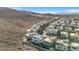 Aerial view of a modern home community nestled in a desert landscape, showcasing the homes' unique architectural designs at 232 Errogie St, Henderson, NV 89012