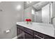 Modern bathroom with dark vanity and white countertop at 232 Errogie St, Henderson, NV 89012