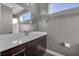 Simple bathroom with vanity and a large mirror at 232 Errogie St, Henderson, NV 89012