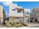 Contemporary two-story home with clean lines, gray stone accents, and a landscaped front yard at 232 Errogie St, Henderson, NV 89012