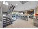 Open concept kitchen with modern staircase and island at 232 Errogie St, Henderson, NV 89012