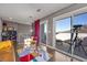 Bright loft sitting area with glass doors leading to a balcony and mountain views at 232 Errogie St, Henderson, NV 89012