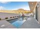 Inviting swimming pool with spacious patio and mountain views at 232 Errogie St, Henderson, NV 89012