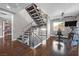 Modern staircase with metal railing and hardwood steps at 232 Errogie St, Henderson, NV 89012