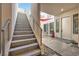 Modern staircase leading to a private courtyard at 232 Errogie St, Henderson, NV 89012