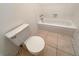 Clean bathroom with a shower/tub combo and tile flooring at 2386 Pickwick Dr, Henderson, NV 89014