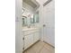 Bright bathroom with vanity, mirror, and tiled floor at 2386 Pickwick Dr, Henderson, NV 89014