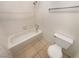 Clean bathroom with a shower/tub combo and tile flooring at 2386 Pickwick Dr, Henderson, NV 89014