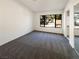 Spacious carpeted bedroom with large window and closet at 2386 Pickwick Dr, Henderson, NV 89014