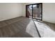 Bright bedroom with carpeted floor and sliding glass door to balcony at 2386 Pickwick Dr, Henderson, NV 89014