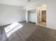 Spacious bedroom with carpeted floor and access to a bathroom at 2386 Pickwick Dr, Henderson, NV 89014