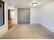 Simple dining area with tiled floor and grey cabinets at 2386 Pickwick Dr, Henderson, NV 89014