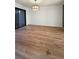 Dining area with hardwood floors and modern light fixture at 2386 Pickwick Dr, Henderson, NV 89014