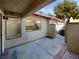 Private patio with view of kitchen window and gate at 2386 Pickwick Dr, Henderson, NV 89014