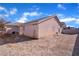 View of the home's backyard, mostly gravel at 2419 Country Valley Ct, North Las Vegas, NV 89030