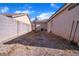 Side yard with gravel and a small tree at 2419 Country Valley Ct, North Las Vegas, NV 89030