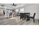 Kitchen features a dining area with a gray table and black chairs at 2419 Country Valley Ct, North Las Vegas, NV 89030