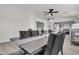 Dining area with a long gray table and black chairs at 2419 Country Valley Ct, North Las Vegas, NV 89030