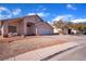 Single story house with driveway and small front yard at 2419 Country Valley Ct, North Las Vegas, NV 89030