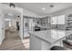 Modern kitchen with gray cabinets and quartz countertops at 2419 Country Valley Ct, North Las Vegas, NV 89030