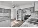 Updated kitchen featuring gray cabinets and stainless steel appliances at 2419 Country Valley Ct, North Las Vegas, NV 89030