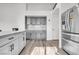 Spacious kitchen with gray cabinets and ample storage space at 2419 Country Valley Ct, North Las Vegas, NV 89030