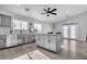 Modern kitchen with gray cabinets, island, and stainless steel appliances at 2419 Country Valley Ct, North Las Vegas, NV 89030