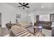 Relaxing living room with hardwood floors and large windows at 2419 Country Valley Ct, North Las Vegas, NV 89030