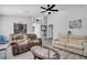 Open concept living room with neutral decor and hardwood floors at 2419 Country Valley Ct, North Las Vegas, NV 89030