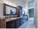 Elegant bathroom with dark wood cabinets and marble countertops at 2521 Seascape Dr, Las Vegas, NV 89128