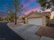 House exterior with driveway and landscaping at 2521 Seascape Dr, Las Vegas, NV 89128