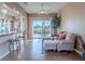 Bright living room with lake view, comfy seating and hardwood floors at 2521 Seascape Dr, Las Vegas, NV 89128