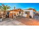 Spacious backyard with patio, shed, and mature palm trees at 2608 Spear St, North Las Vegas, NV 89030