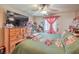 Bedroom with king-size bed, dresser, and ceiling fan at 2608 Spear St, North Las Vegas, NV 89030