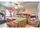 Main bedroom with a king-size bed and ceiling fan at 2608 Spear St, North Las Vegas, NV 89030