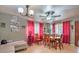 Dining area with wooden table and red curtains at 2608 Spear St, North Las Vegas, NV 89030