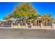 House with tree-lined street and a well-maintained yard at 2608 Spear St, North Las Vegas, NV 89030