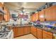 Kitchen features wood cabinets, granite counters, and a gas range at 2608 Spear St, North Las Vegas, NV 89030