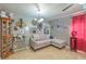 Living room with sectional sofa and decorative shelving at 2608 Spear St, North Las Vegas, NV 89030