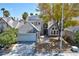 Two-story house with a gray exterior, solar panels, and landscaped yard at 2632 Cathedral Ln, Las Vegas, NV 89108