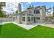 House exterior showcasing artificial turf and a large grassy area at 2632 Cathedral Ln, Las Vegas, NV 89108