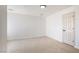 Bright bedroom featuring plush carpet and an interior door at 2632 Cathedral Ln, Las Vegas, NV 89108