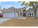 Two-story house with gray exterior, attached garage, and walkway at 2632 Cathedral Ln, Las Vegas, NV 89108