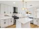 Modern kitchen with white cabinets, quartz countertops, and island at 2632 Cathedral Ln, Las Vegas, NV 89108