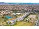 Aerial view of community park with tennis courts and clubhouse at 2812 Dotted Wren Ave, North Las Vegas, NV 89084